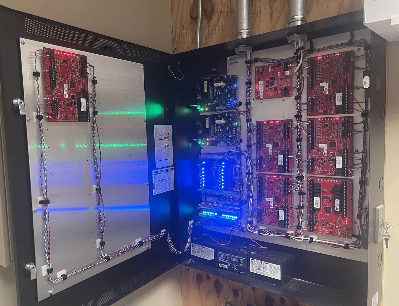 Open access control cabinet and door-mounted electronics.