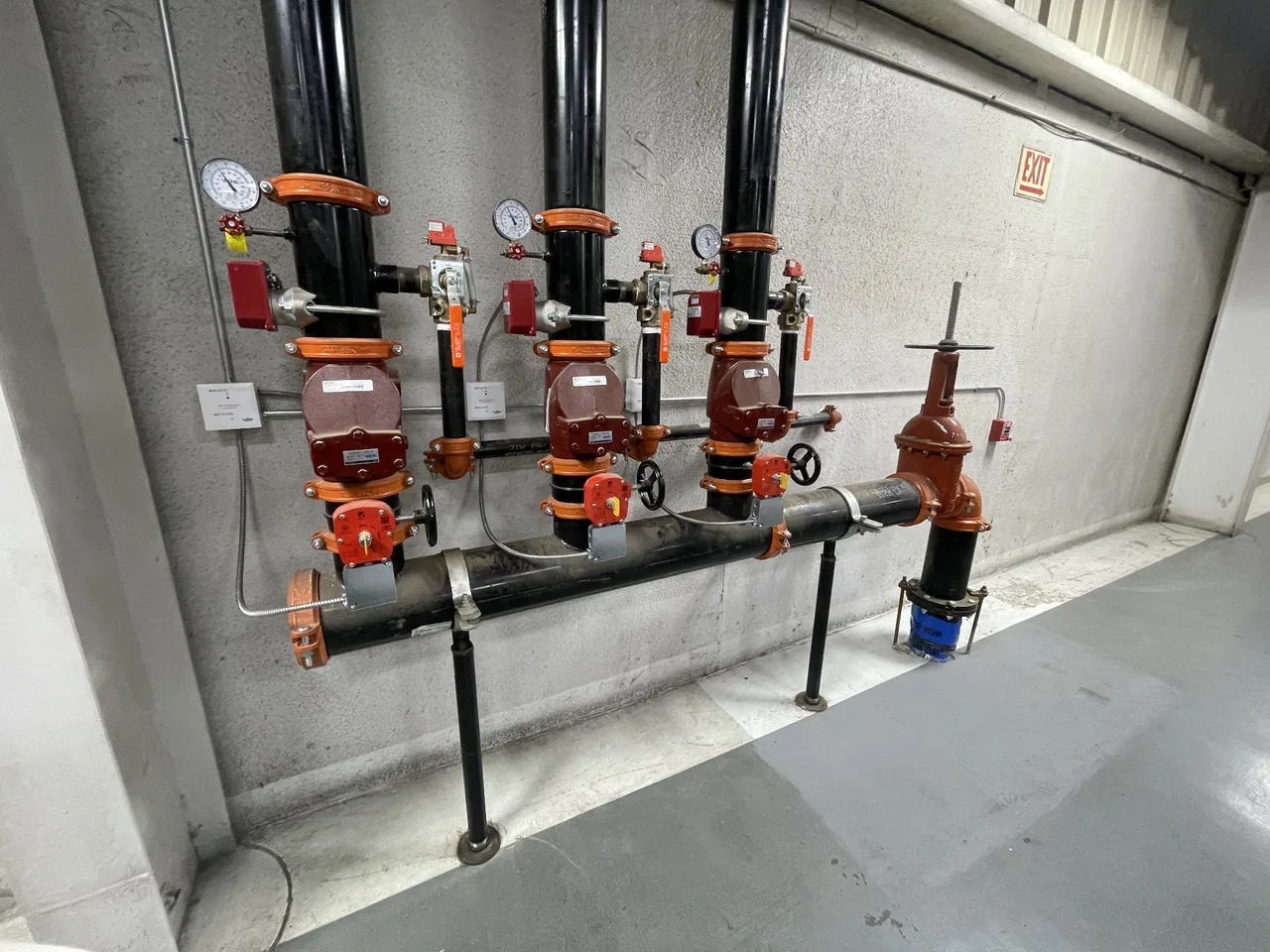 Sprinkler risers with monitoring devices, interface modules and conduit.